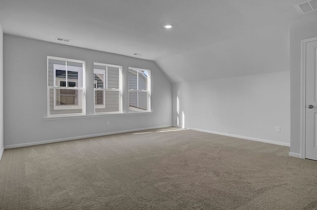 bonus room featuring carpet and vaulted ceiling