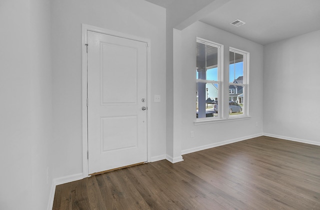 entryway with dark hardwood / wood-style floors