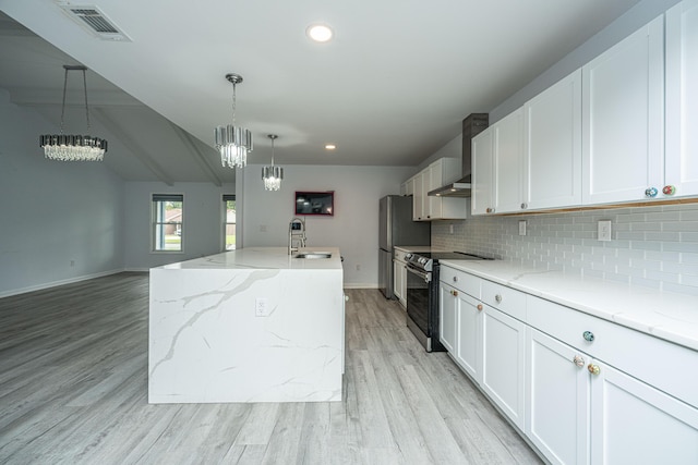 133 Marion Rd, Summerville, SC 29486 - kitchen with a sink, wall chimney exhaust hood, stainless steel appliances, decorative backsplash, and an inviting chandelier