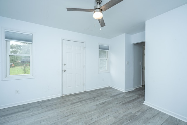 empty room featuring light wood-type flooring and ceiling fan