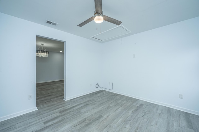 133 Marion Rd, Summerville, SC 29486 - spare room with wood finished floors, attic access, ceiling fan, and visible vents