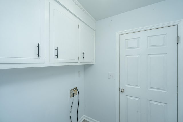 laundry area with washer hookup and cabinets