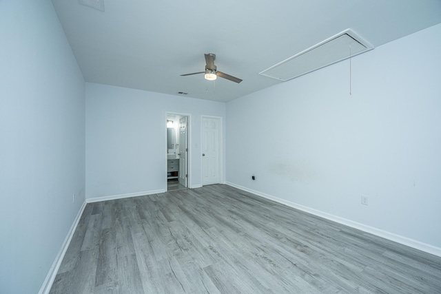 133 Marion Rd, Summerville, SC 29486 - unfurnished bedroom featuring attic access, baseboards, ensuite bath, a ceiling fan, and wood finished floors