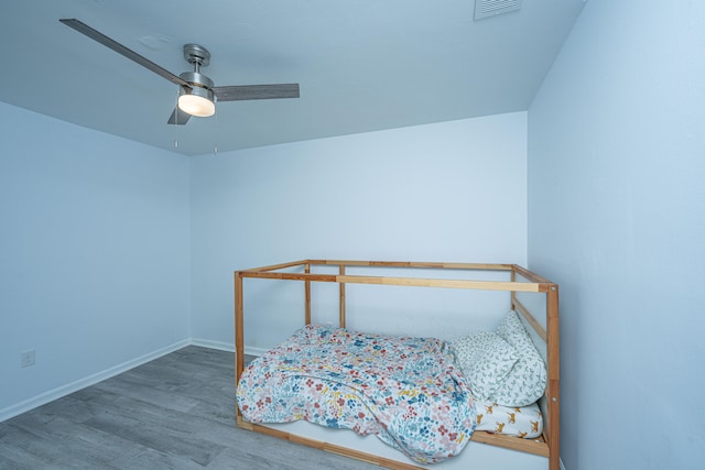 bedroom featuring wood-type flooring and ceiling fan