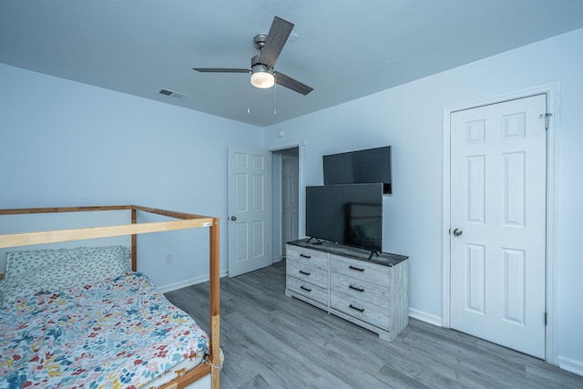 bedroom featuring ceiling fan and light wood-type flooring