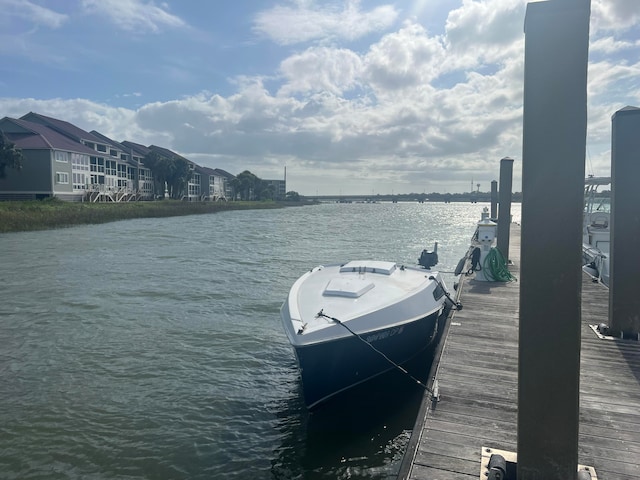 dock area featuring a water view