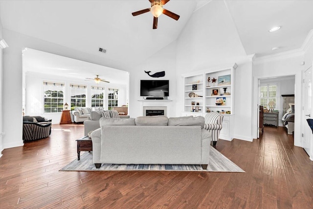 1003 Jervey Point Rd, Wando, SC 29492 - living area featuring ceiling fan, a fireplace, high vaulted ceiling, dark wood finished floors, and baseboards