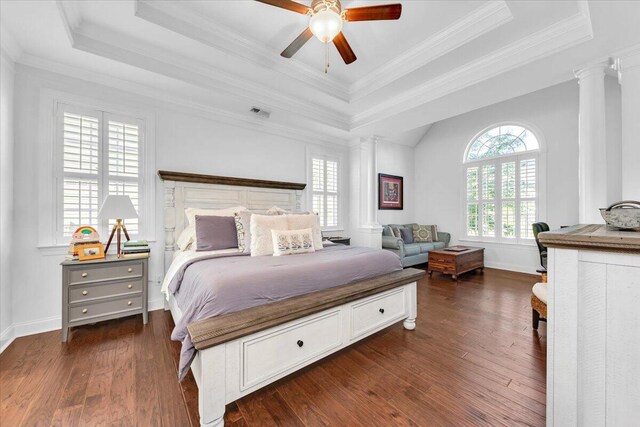 1003 Jervey Point Rd, Wando, SC 29492 - bedroom featuring ornate columns, a raised ceiling, dark wood-style floors, baseboards, and crown molding