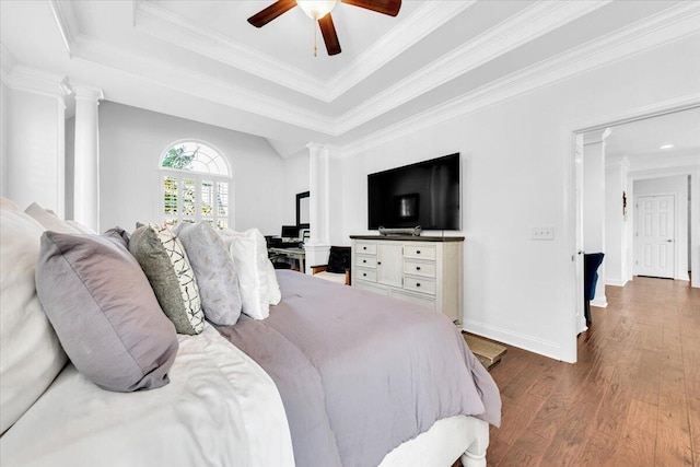 1003 Jervey Point Rd, Wando, SC 29492 - bedroom with decorative columns, a tray ceiling, wood finished floors, ornamental molding, and baseboards