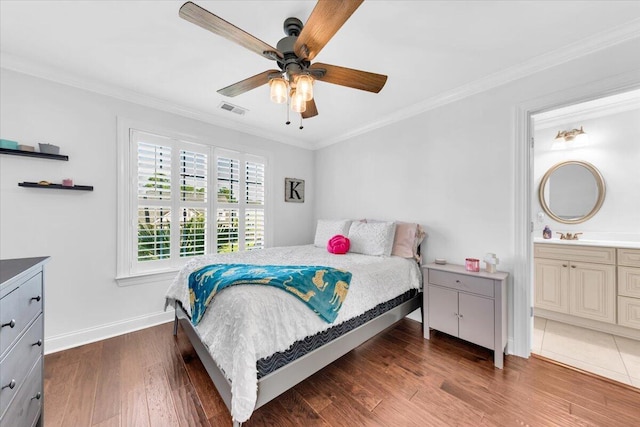1003 Jervey Point Rd, Wando, SC 29492 - bedroom featuring crown molding, wood finished floors, baseboards, ensuite bath, and ceiling fan