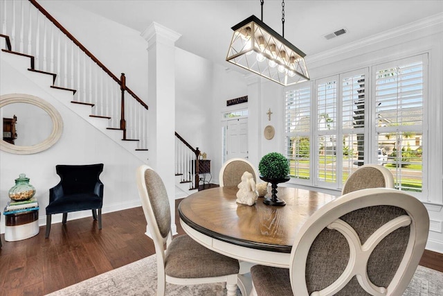 1003 Jervey Point Rd, Wando, SC 29492 - dining room featuring wood finished floors, stairs, healthy amount of natural light, baseboards, and ornamental molding