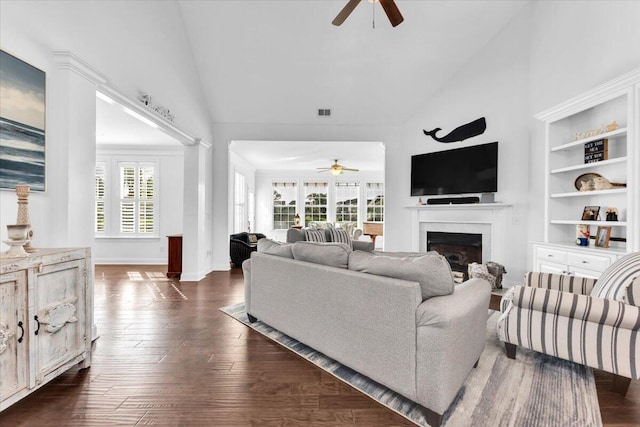 1003 Jervey Point Rd, Wando, SC 29492 - living room featuring ceiling fan, a fireplace, high vaulted ceiling, dark wood-type flooring, and baseboards