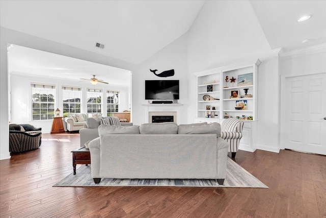 1003 Jervey Point Rd, Wando, SC 29492 - living area featuring high vaulted ceiling, ceiling fan, a fireplace, dark wood-type flooring, and crown molding