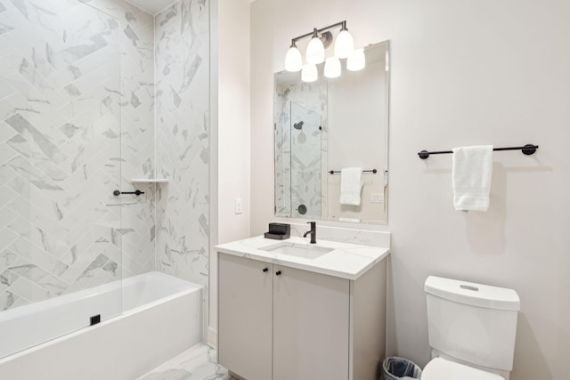 full bathroom featuring vanity, toilet, and tiled shower / bath