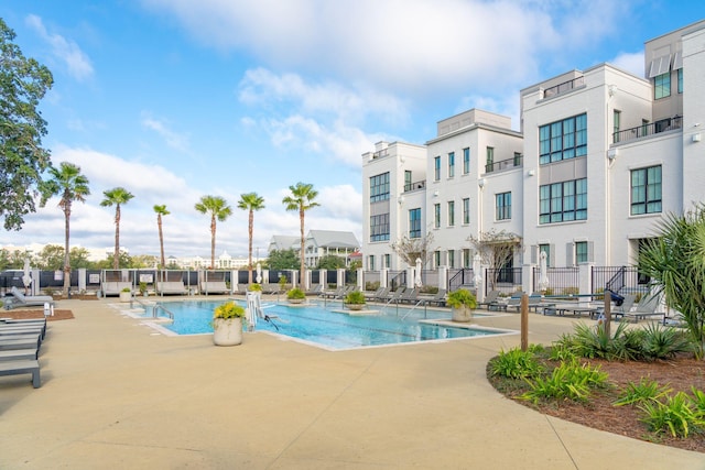 view of swimming pool with a patio area