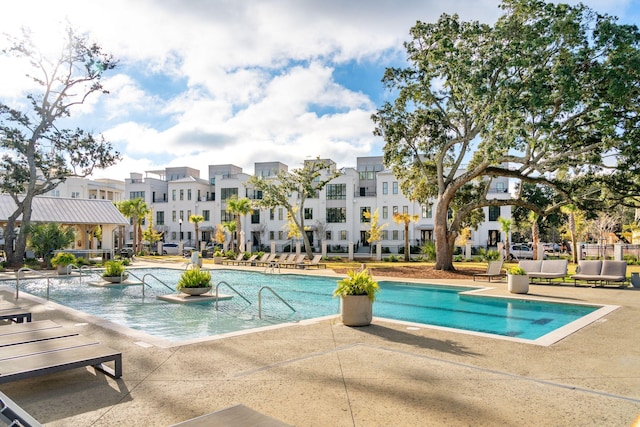 view of pool featuring a patio area