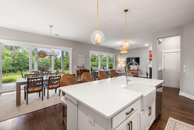125 Integrity Ln, Charleston, SC 29492 - kitchen featuring a chandelier, a sink, stainless steel dishwasher, light countertops, and dark wood-type flooring