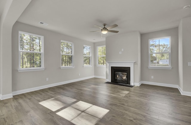 125 Integrity Ln, Charleston, SC 29492 - unfurnished living room featuring plenty of natural light, a ceiling fan, baseboards, and wood finished floors