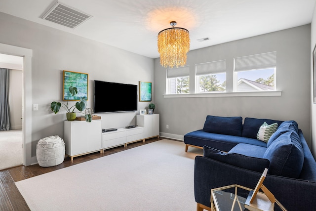 125 Integrity Ln, Charleston, SC 29492 - living area featuring wood finished floors, a chandelier, and baseboards