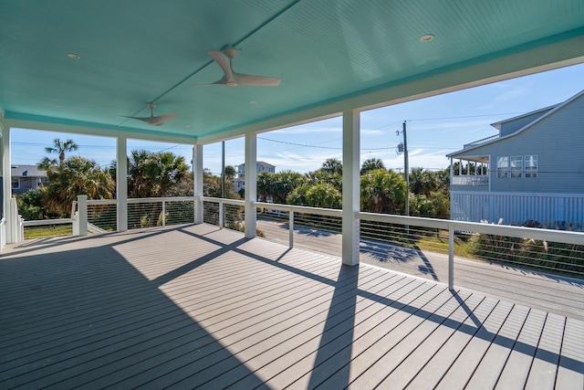 wooden terrace featuring ceiling fan