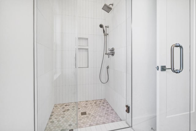 bathroom featuring an enclosed shower