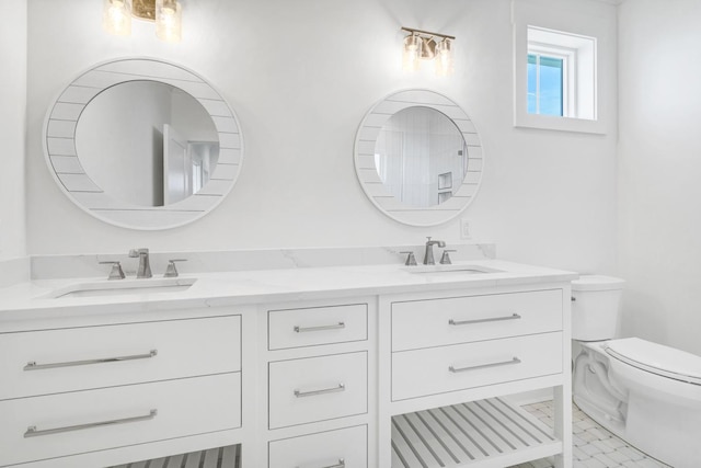 bathroom featuring vanity and toilet