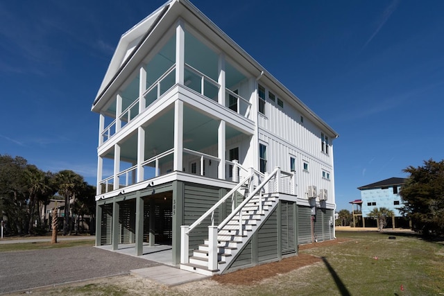 rear view of house featuring a yard