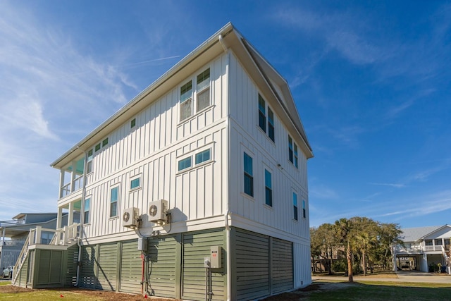 view of property exterior featuring ac unit and a lawn