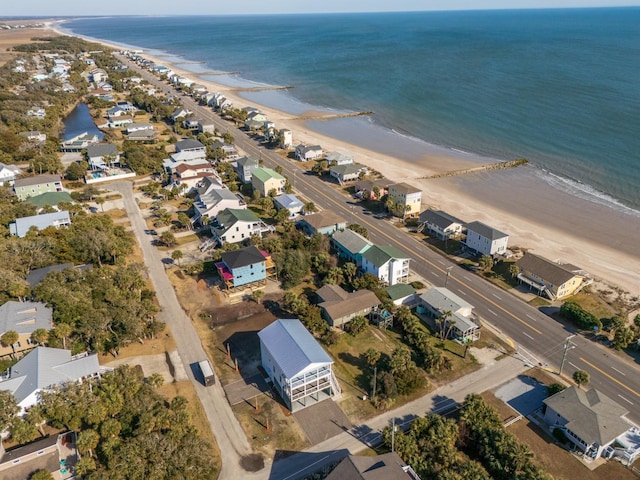 drone / aerial view with a beach view and a water view