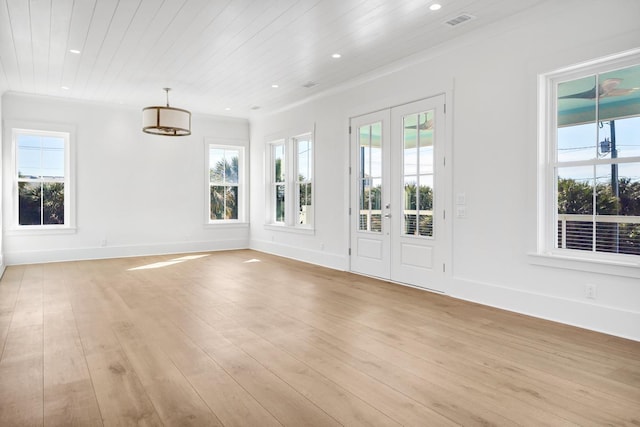 empty room featuring wooden ceiling, light hardwood / wood-style floors, and french doors