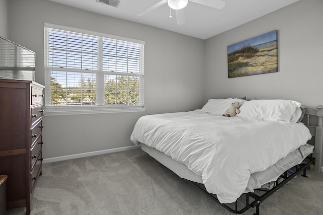 bedroom featuring ceiling fan and light carpet