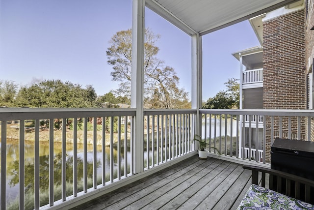 deck featuring a water view