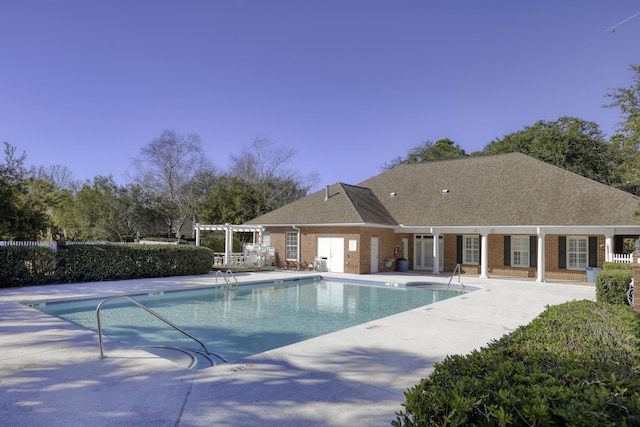 view of swimming pool featuring a pergola and a patio