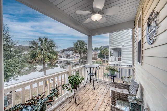 balcony with a residential view and ceiling fan