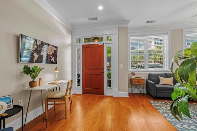 656 Coleman Blvd Unit 405, Mount Pleasant, SC 29464 - foyer entrance featuring light wood-type flooring, crown molding, visible vents, and baseboards
