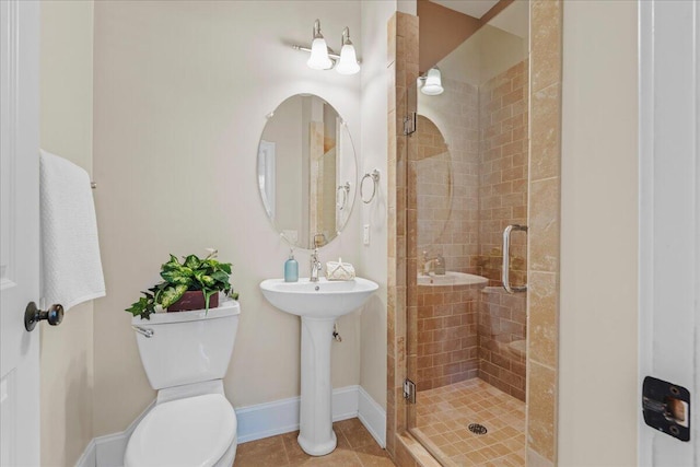 656 Coleman Blvd Unit 405, Mount Pleasant, SC 29464 - bathroom with a sink, toilet, a stall shower, tile patterned flooring, and baseboards