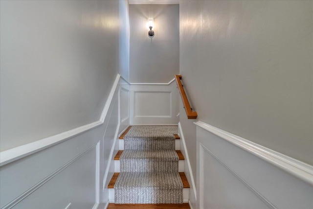 656 Coleman Blvd Unit 405, Mount Pleasant, SC 29464 - staircase featuring a wainscoted wall and a decorative wall