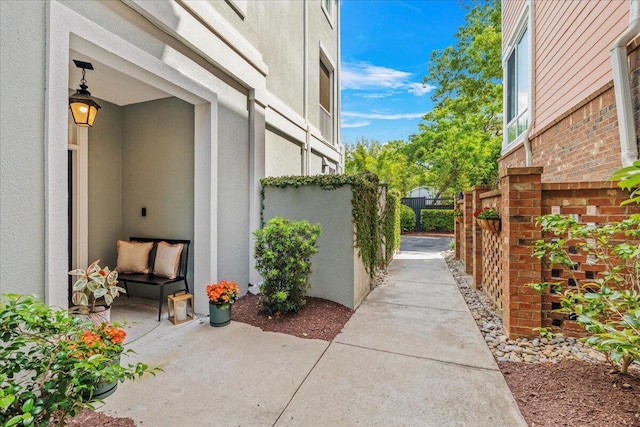 656 Coleman Blvd Unit 405, Mount Pleasant, SC 29464 - view of home's exterior featuring stucco siding, fence, and a patio area