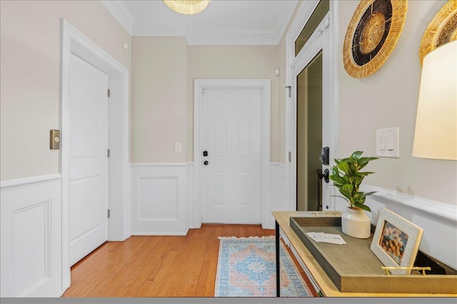 656 Coleman Blvd Unit 405, Mount Pleasant, SC 29464 - entryway featuring crown molding, light wood-type flooring, and a wainscoted wall