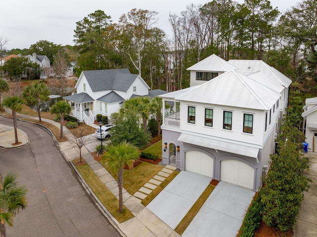 view of front of home with a balcony and a garage