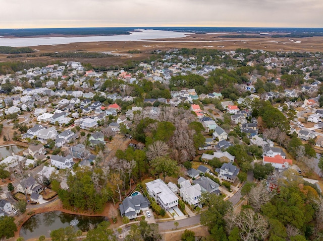 aerial view at dusk with a water view