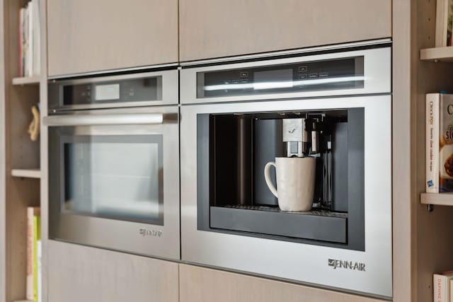 details featuring oven and light brown cabinets