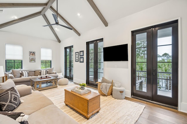 living room featuring light hardwood / wood-style flooring, french doors, high vaulted ceiling, ceiling fan, and beamed ceiling