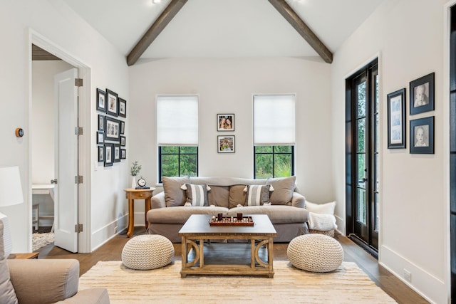 sitting room featuring hardwood / wood-style floors and lofted ceiling with beams