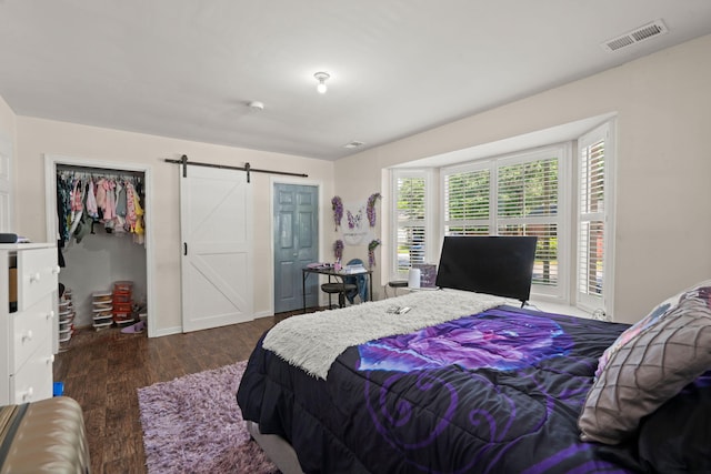 2170 Midland Park Rd, North Charleston, SC 29406 - bedroom with a barn door and wood finished floors