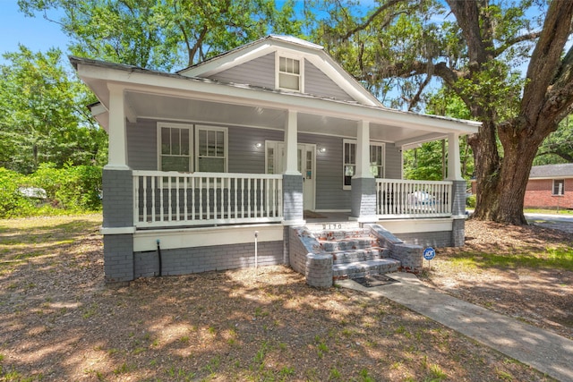 2170 Midland Park Rd, North Charleston, SC 29406 - view of front facade featuring covered porch and brick siding