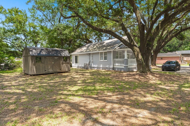 2170 Midland Park Rd, North Charleston, SC 29406 - rear view of house with a storage unit