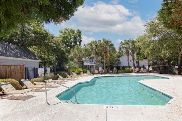 view of swimming pool with a patio area