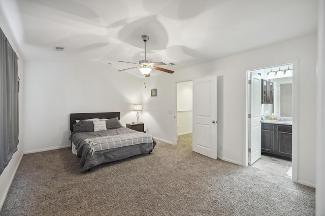 9088 Parlor Dr, Ladson, SC 29456 - bedroom featuring light carpet, baseboards, vaulted ceiling, ceiling fan, and connected bathroom