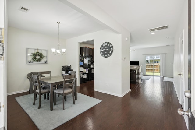 9088 Parlor Dr, Ladson, SC 29456 - dining room featuring baseboards, dark wood finished floors, and a chandelier